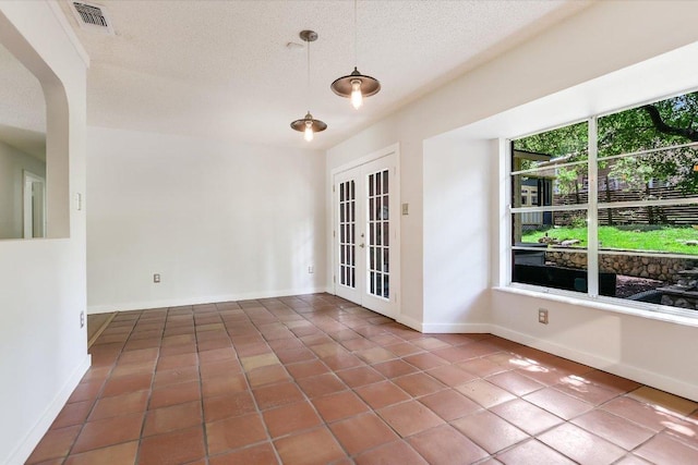3508 Winfield Cv, Austin, TX 78704 - tiled empty room with a textured ceiling and baseboards