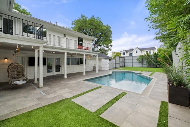 3115 Thousand Oaks Dr, Austin, TX 78746 - view of swimming pool with ceiling fan, a patio, and french doors