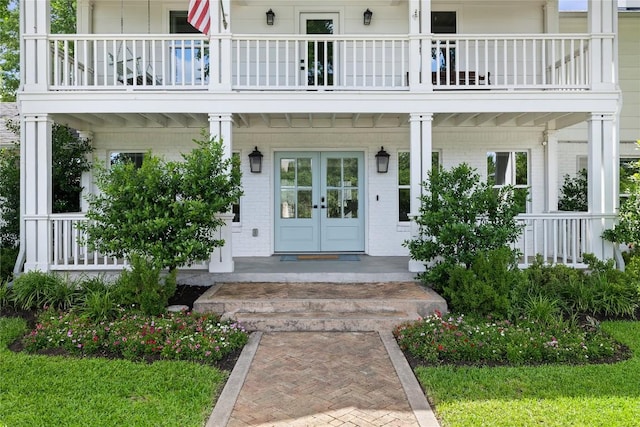 3115 Thousand Oaks Dr, Austin, TX 78746 - entrance to property with a balcony, covered porch, french doors, and brick siding