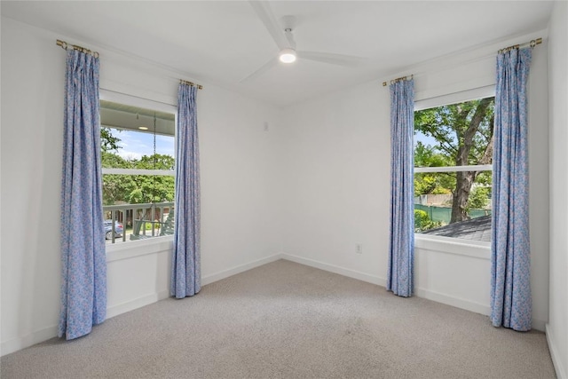 3115 Thousand Oaks Dr, Austin, TX 78746 - empty room featuring carpet floors, plenty of natural light, a ceiling fan, and baseboards