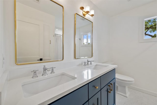 3115 Thousand Oaks Dr, Austin, TX 78746 - bathroom featuring tile patterned floors, toilet, double vanity, and baseboards