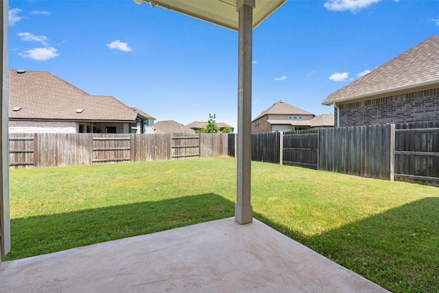 view of yard with a patio and a residential view