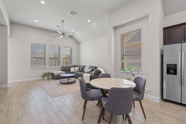 dining area featuring a ceiling fan, light wood-style flooring, baseboards, lofted ceiling, and recessed lighting