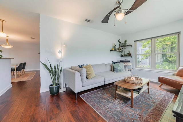 8313 Burrell Dr, Austin, TX 78757 - living room with a ceiling fan, wood finished floors, and baseboards