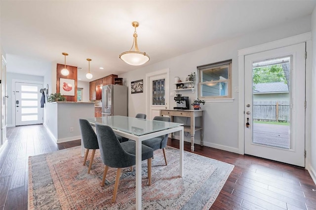 8313 Burrell Dr, Austin, TX 78757 - dining area with dark wood finished floors and baseboards