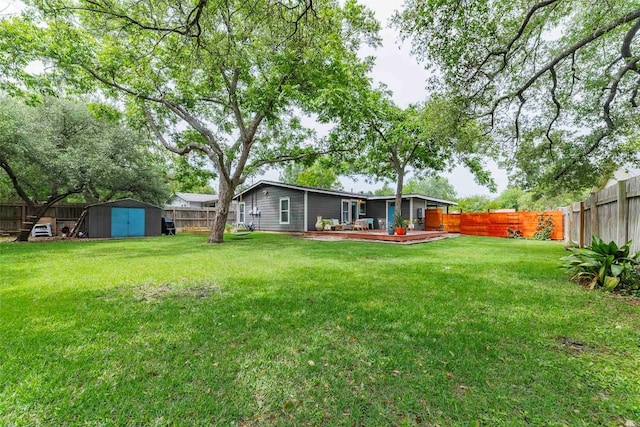 8313 Burrell Dr, Austin, TX 78757 - view of yard with a storage unit, an outbuilding, and a deck