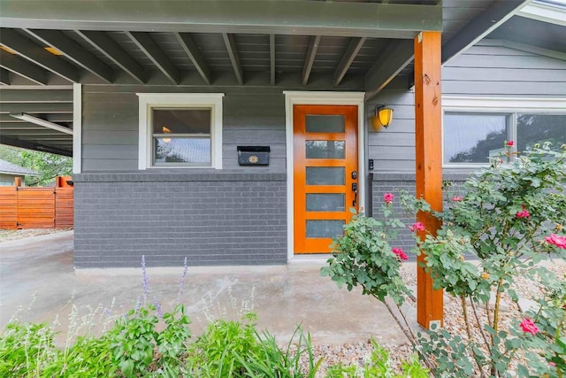 8313 Burrell Dr, Austin, TX 78757 - view of exterior entry featuring fence and brick siding