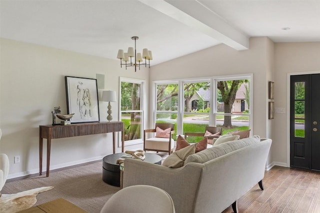 1513 Westover Rd, Austin, TX 78703 - living room featuring plenty of natural light, wood finished floors, and a chandelier