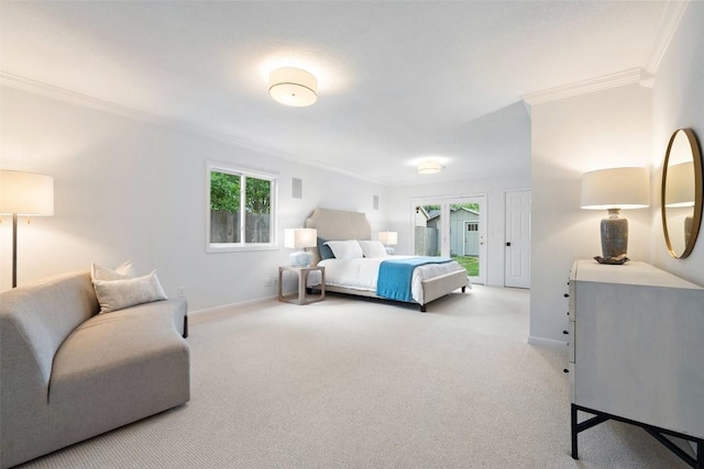 bedroom with crown molding, carpet floors, and baseboards