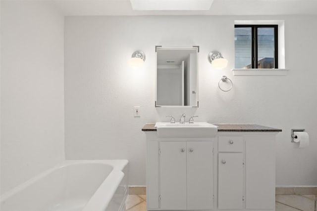 1513 Westover Rd, Austin, TX 78703 - bathroom featuring a bath, vanity, baseboards, and tile patterned floors