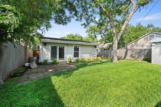 rear view of house with board and batten siding and cooling unit