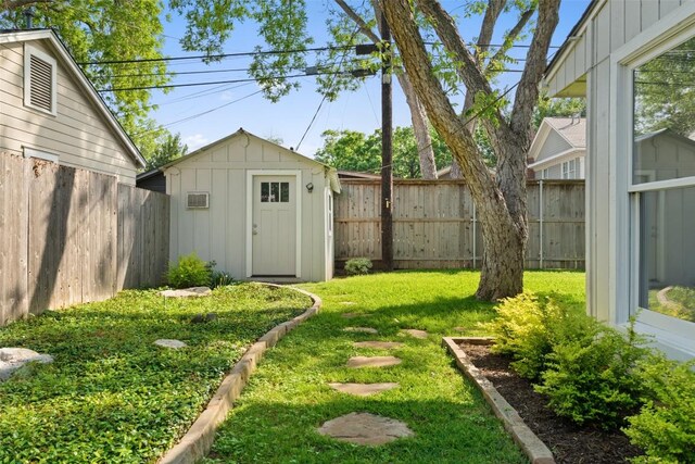 1513 Westover Rd, Austin, TX 78703 - fenced backyard with a storage shed and a wall mounted AC