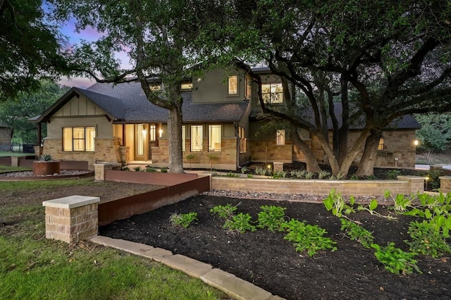 209 Ridge View Dr, Georgetown, TX 78628 - rear view of house with board and batten siding, stone siding, and roof with shingles