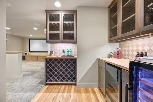 209 Ridge View Dr, Georgetown, TX 78628 - indoor dry bar featuring beverage cooler, tasteful backsplash, recessed lighting, and baseboards