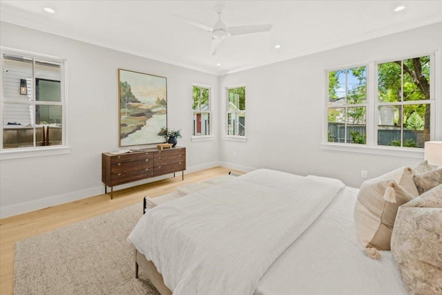 2625 Exposition Blvd, Austin, TX 78703 - bedroom featuring multiple windows, wood finished floors, baseboards, recessed lighting, and ornamental molding
