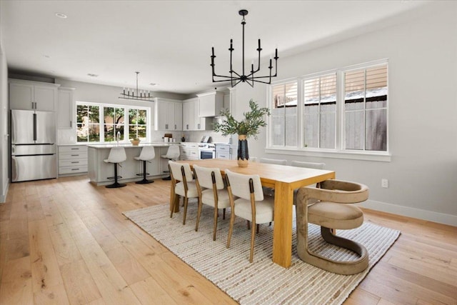 2625 Exposition Blvd, Austin, TX 78703 - dining room with a chandelier, light wood finished floors, baseboards, and recessed lighting