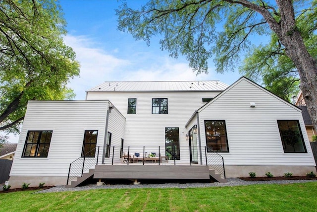 2625 Exposition Blvd, Austin, TX 78703 - back of house with a wooden deck, a lawn, and metal roof