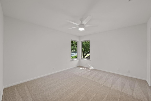 6304 John Chisum Ln, Austin, TX 78749 - unfurnished room with light carpet, ceiling fan, and baseboards