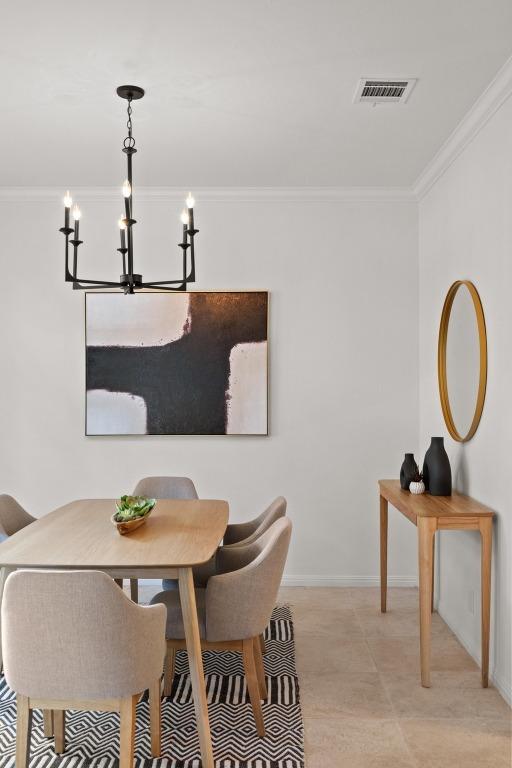6304 John Chisum Ln, Austin, TX 78749 - dining room with a chandelier, ornamental molding, and baseboards