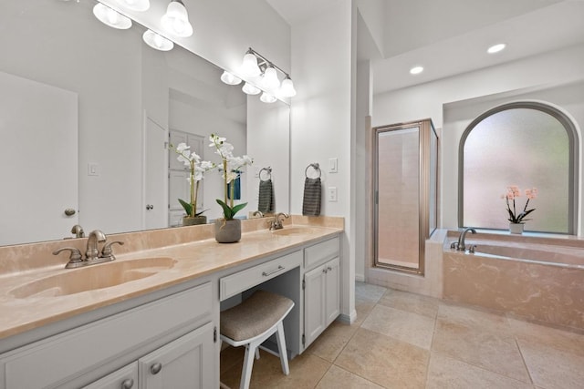6304 John Chisum Ln, Austin, TX 78749 - full bathroom featuring a stall shower, double vanity, tile patterned floors, a bath, and recessed lighting