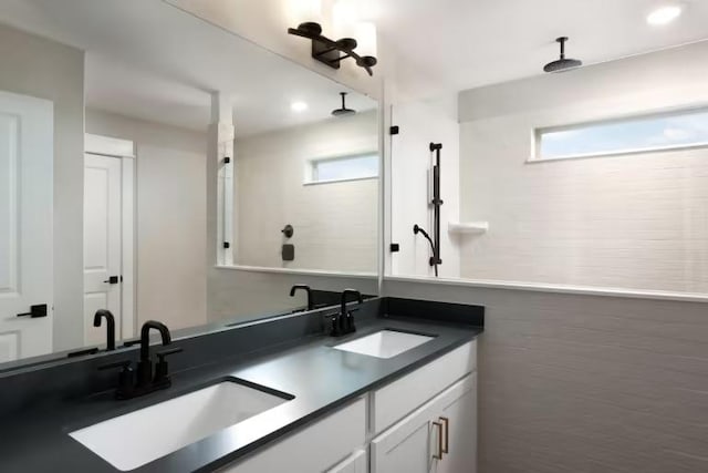 237 Regatta Trl, Leander, TX 78641 - full bath with double vanity, recessed lighting, and a shower