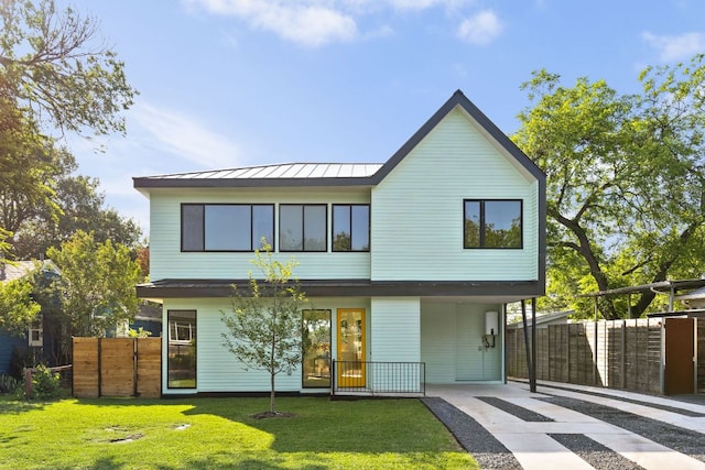2903 Breeze Ter Unit 1, Austin, TX 78722 - rear view of property with driveway, a standing seam roof, metal roof, and a carport