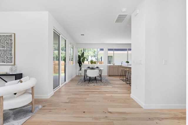 2903 Breeze Ter Unit 1, Austin, TX 78722 - hallway with light wood-style floors, baseboards, and an office area