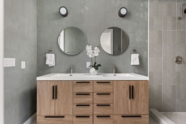 2903 Breeze Ter Unit 1, Austin, TX 78722 - bathroom featuring double vanity and a tile shower