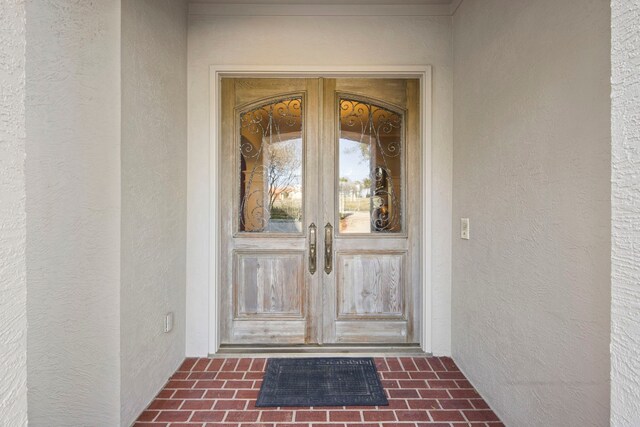 124 Florentine, Horseshoe Bay, TX 78657 - entrance to property featuring french doors and stucco siding