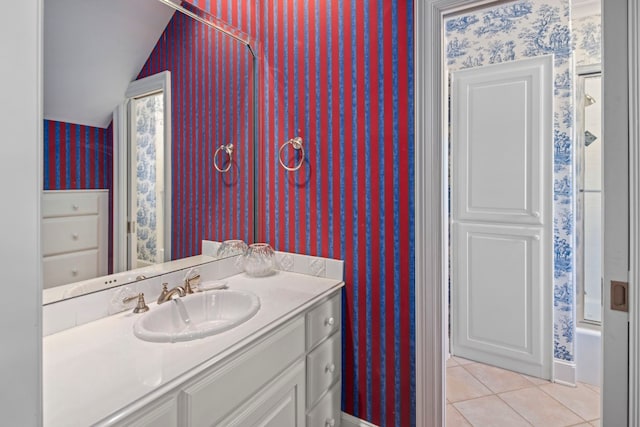 124 Florentine, Horseshoe Bay, TX 78657 - full bathroom with wallpapered walls, vaulted ceiling, tile patterned flooring, vanity, and a shower