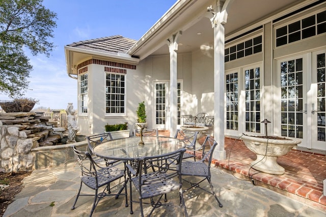 124 Florentine, Horseshoe Bay, TX 78657 - view of patio with french doors and outdoor dining area