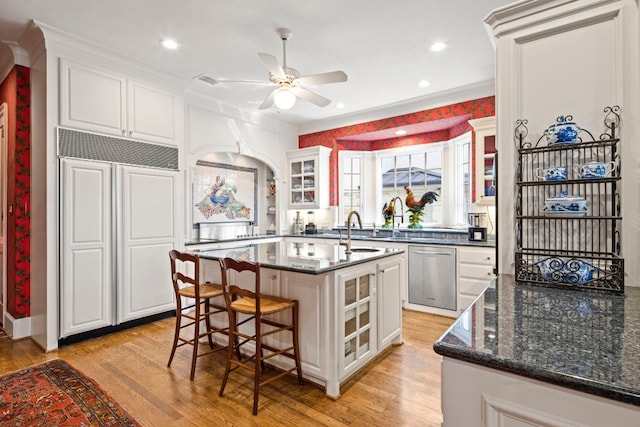 124 Florentine, Horseshoe Bay, TX 78657 - kitchen with dishwasher, paneled fridge, light wood-type flooring, glass insert cabinets, and ornamental molding