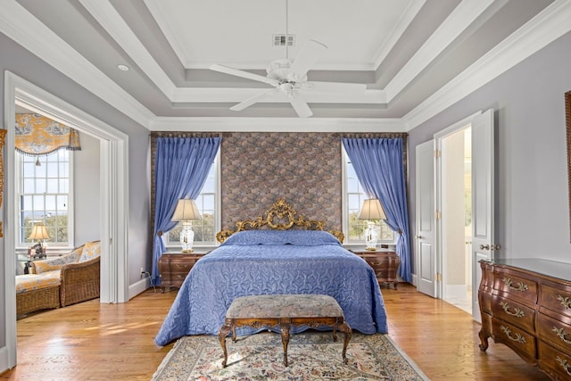 124 Florentine, Horseshoe Bay, TX 78657 - bedroom with multiple windows, wood finished floors, ceiling fan, baseboards, and crown molding
