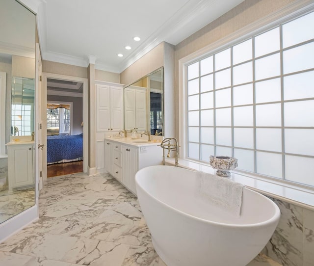 124 Florentine, Horseshoe Bay, TX 78657 - ensuite bathroom with ornamental molding, marble finish floors, vanity, a freestanding bath, and recessed lighting