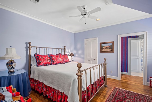 124 Florentine, Horseshoe Bay, TX 78657 - bedroom featuring baseboards, wood finished floors, ornamental molding, and a ceiling fan