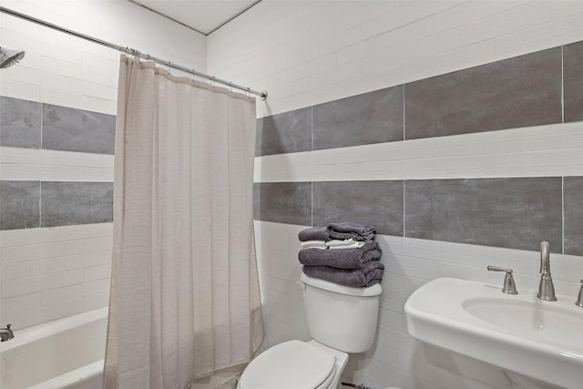 2124 Crabapple Rd, Blanco, TX 78606 - bathroom with tile walls, a sink, toilet, and shower / bathtub combination with curtain