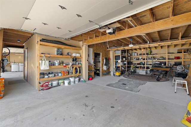 2124 Crabapple Rd, Blanco, TX 78606 - garage featuring washing machine and dryer and a garage door opener