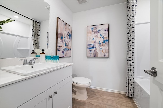 1006 Antelope Trl, Temple, TX 76504 - bathroom featuring wood finished floors, toilet, vanity, baseboards, and recessed lighting
