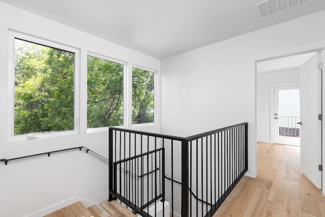 stairway featuring wood finished floors