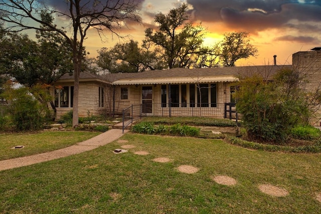 508 Lee St N, Round Rock, TX 78664 - view of front of home featuring stone siding and a front lawn