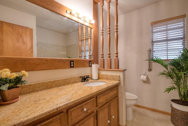 508 Lee St N, Round Rock, TX 78664 - bathroom featuring vanity, toilet, tile patterned flooring, and baseboards