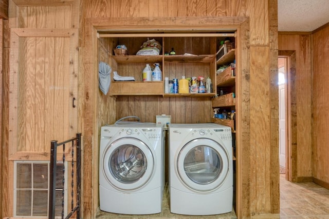 508 Lee St N, Round Rock, TX 78664 - washroom featuring washer and clothes dryer and wood walls
