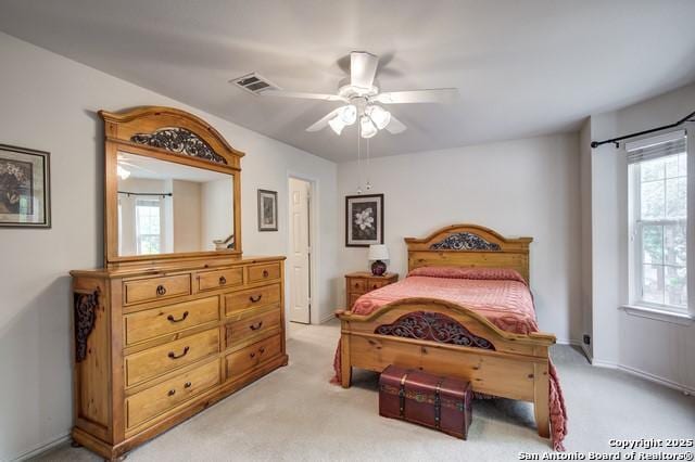 5659 Fergus Unit A, Kyle, TX 78640 - bedroom featuring light carpet and a ceiling fan