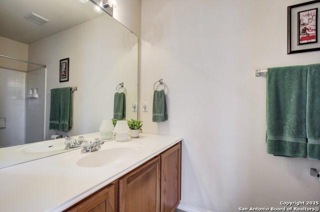 5659 Fergus Unit A, Kyle, TX 78640 - full bath featuring vanity and a shower