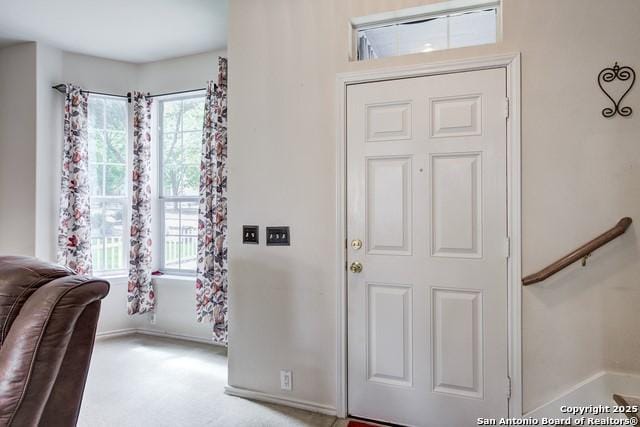 5659 Fergus Unit A, Kyle, TX 78640 - foyer featuring carpet flooring and baseboards