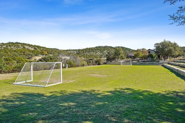 surrounding community featuring an area for sports