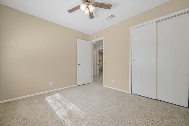 10400 Burmaster Ln Unit A, Austin, TX 78750 - unfurnished bedroom with carpet, baseboards, a closet, and a ceiling fan