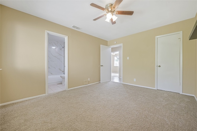10400 Burmaster Ln Unit A, Austin, TX 78750 - unfurnished bedroom with light colored carpet, baseboards, ensuite bath, and a ceiling fan
