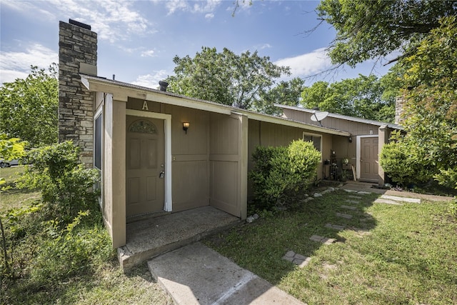 10400 Burmaster Ln Unit A, Austin, TX 78750 - property entrance with a chimney and a yard