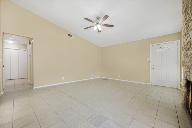 10400 Burmaster Ln Unit A, Austin, TX 78750 - spare room featuring a ceiling fan, attic access, vaulted ceiling, light tile patterned floors, and baseboards
